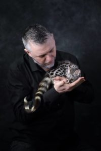 Nigel with genet Neo at the Kent Owl Academy